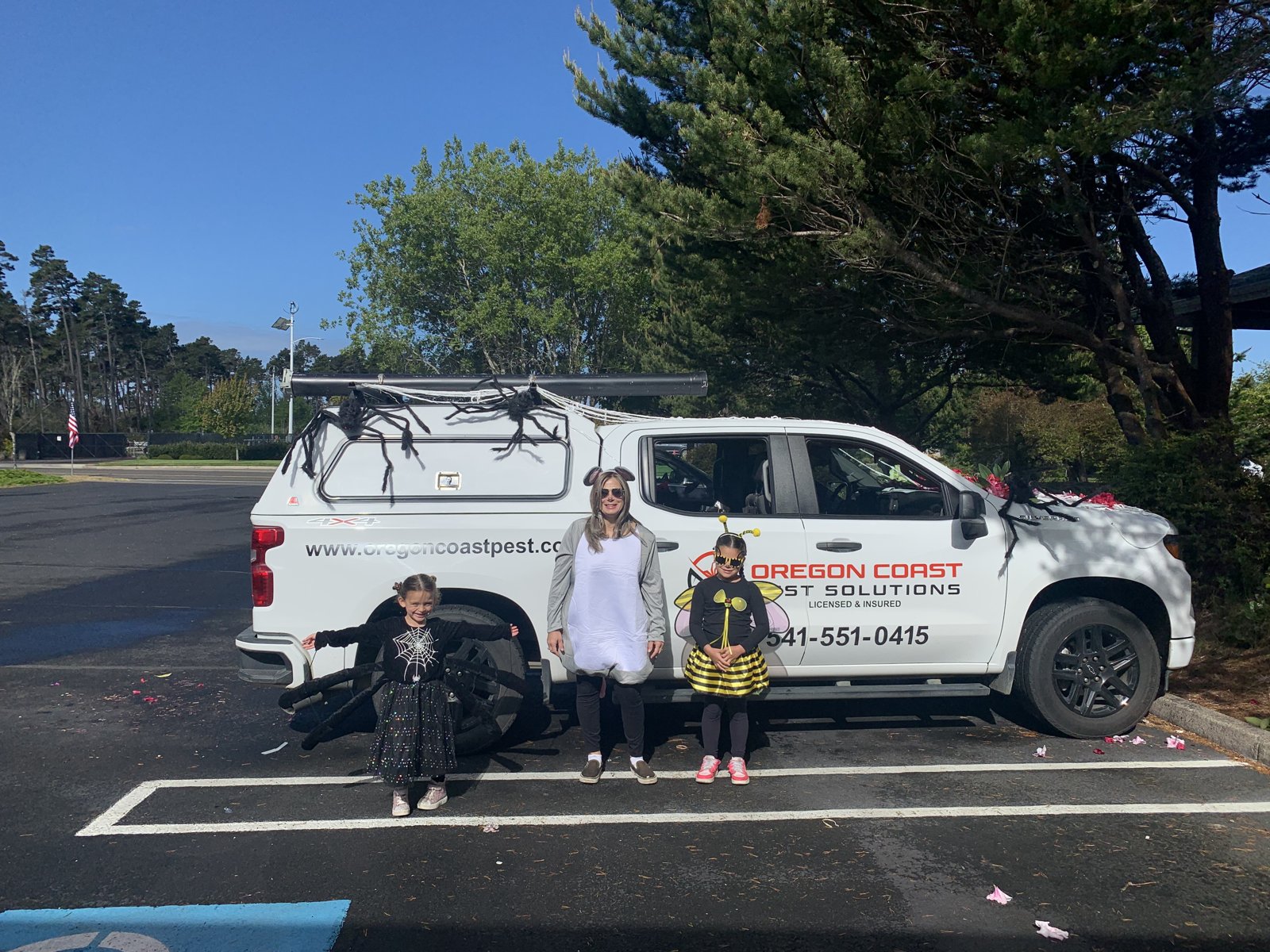 The Oregon Coast Pest Solutions family with our truck in Bandon